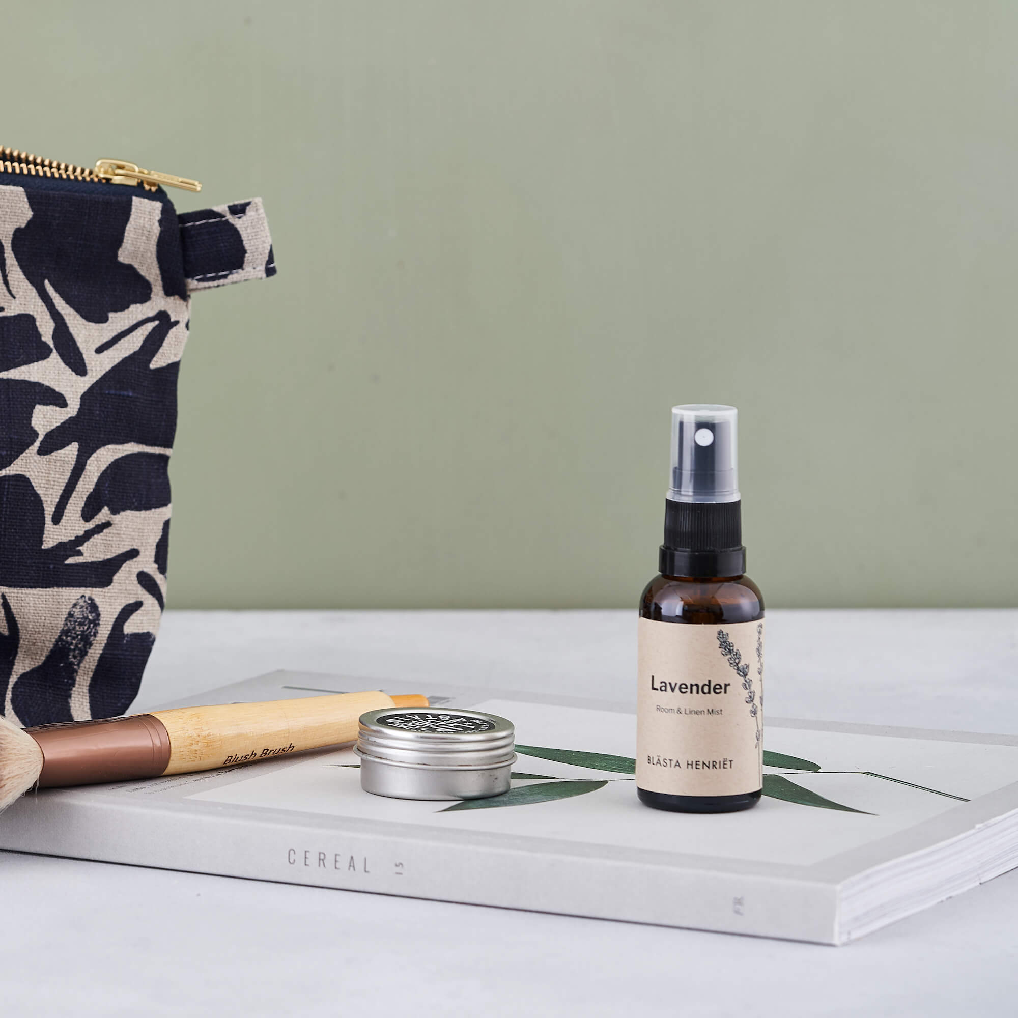 lavender mist on cereal mag with wash bag and makeup