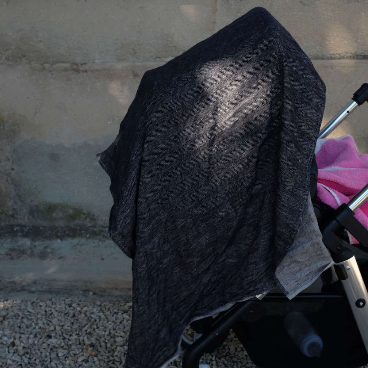 protecting baby from the sun with linen towel